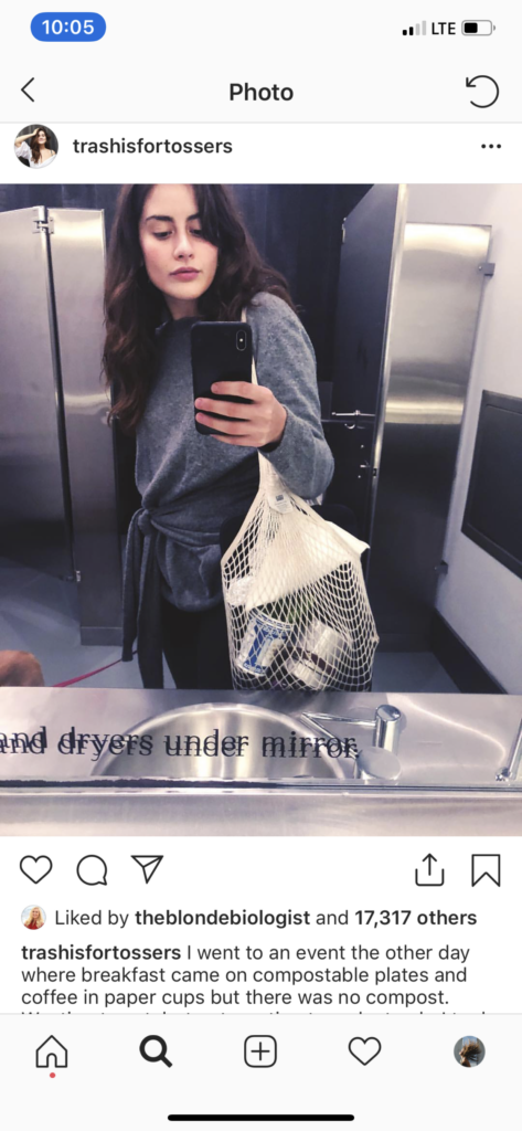 Screen shot of Lauren Singer taking a mirror selfie with her reusable string bag hanging over her shoulder.